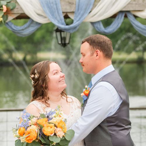 Bride with flowers and groom at Civil War Ranch